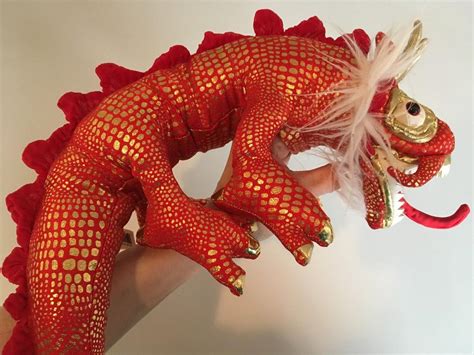Red Chinese Dragon Puppet With Shiny Gold Scales And Toe Nails Folkmanis