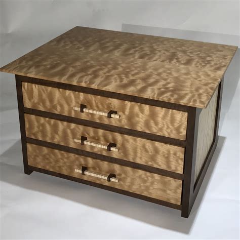 The rich finish and black accents give it an industrial look that'll add some punch to your room. Hand Crafted Quilted Maple And Claro Walnut Chest Of ...