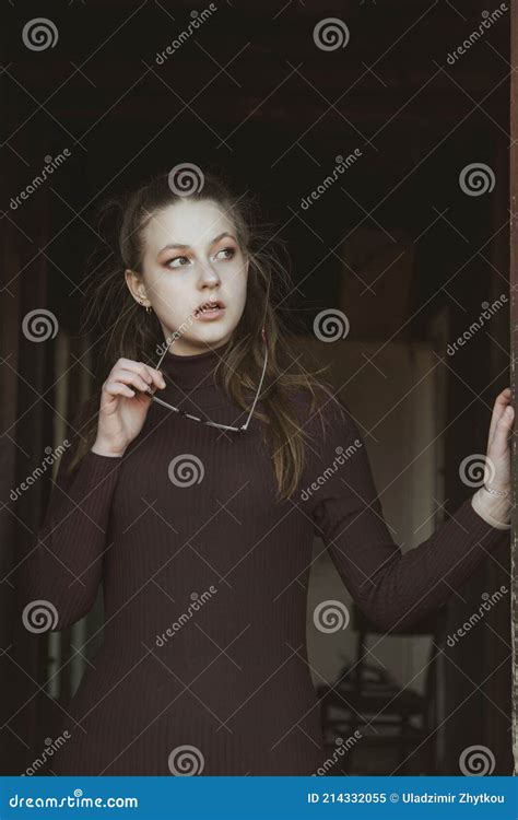 a beautiful girl holds glasses in her hand and thinks about something stock image image of