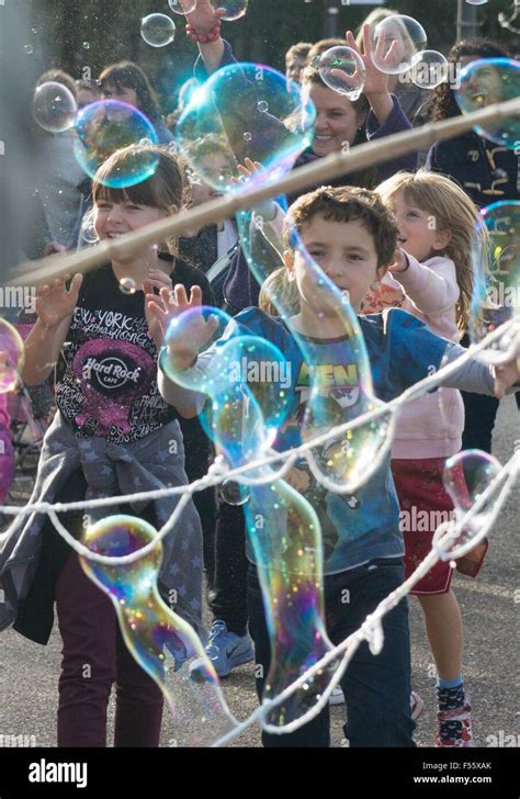 Children Playing Playing With Bubbles Stock Photo Alamy