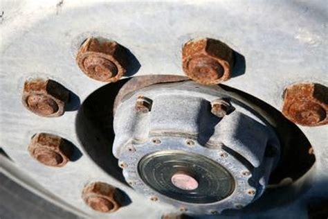 Here's the steps to get them off without breaking the studs. How to Remove Rust From Lug Nuts | It Still Runs