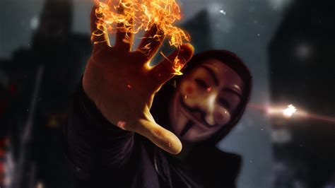 2560x1440 Anonymus Mask Guy With Flame In Hand 4k 1440p Resolution Hd