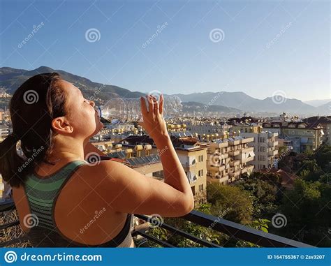 Young Sports Woman Drinking Fresh Water From The Bottle In The Sunny
