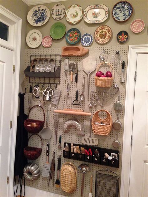 A Wall Mounted With Lots Of Plates And Utensils