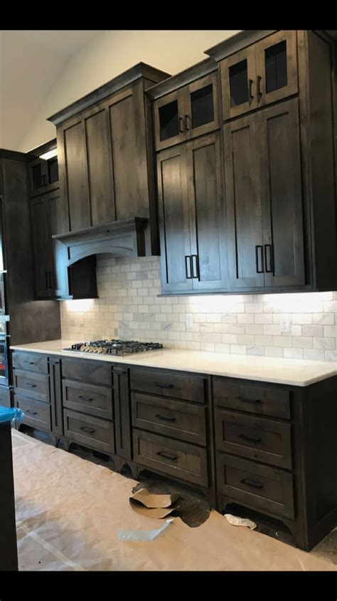 Painting kitchen cabinets rejuvenates your home. Fresh Kitchen Cabinets Painted Black Rustic stain color ...