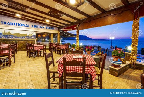 Traditional Cretan Food Restaurant At Paraliaki Promenaad At Sunset In