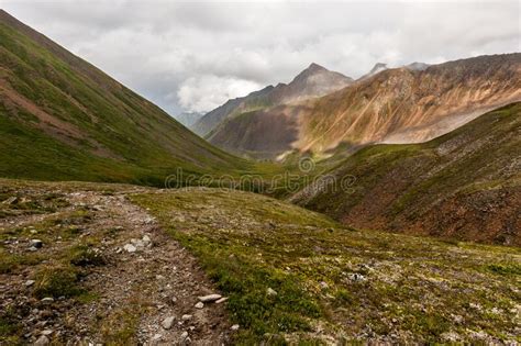 Green Valley With A Rocky Path In The Mountains Stock Photo Image Of