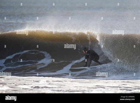 A Surfer On A Wave At The Outer Banks Nc Stock Photo Alamy