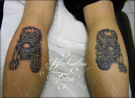 Two People With Tattoos On Their Legs And Arms Both Wearing Black And Grey Ink