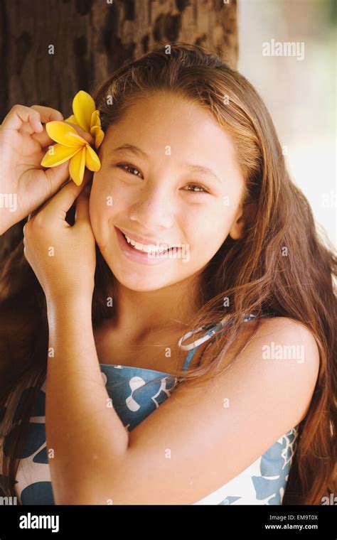 Young Hapa Hawaiian Girl Holding Flower Stock Photo Alamy