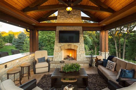 Open Pool House With Stone Fireplace And Travertine Floor Outdoor Tv