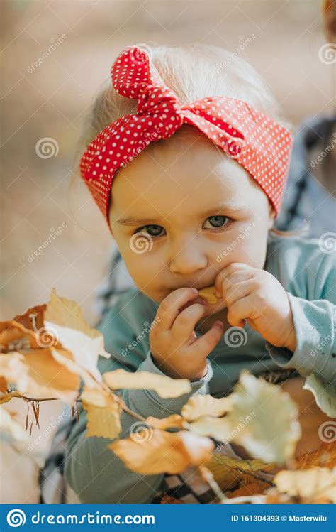 Adorable Girl Having Fun On Beautiful Autumn Day Authentic Childhood