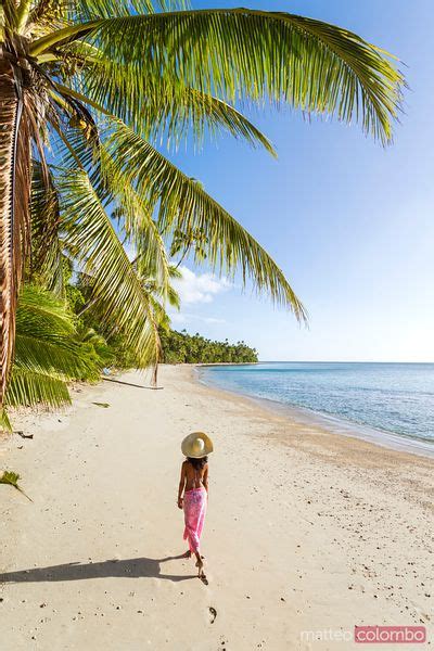 Woman Relaxing On Hammock Under Palm Tree On A Tropical Beach Fiji