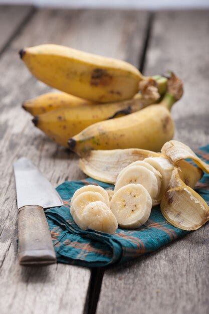 Premium Photo Bananas On Wooden Table