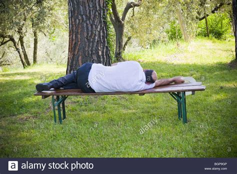 Sleeping On Park Bench Stock Photos And Sleeping On Park Bench Stock