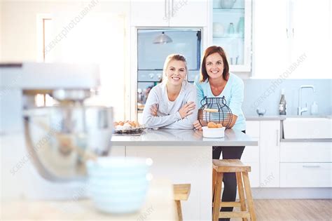 Women Leaning On Kitchen Counter Stock Image F0153309 Science Photo Library