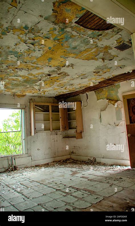 Vertical Shot Of An Interior Of An Abandoned House With Broken