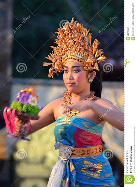 Young Balinese Female Dancer Performing Traditional Dance