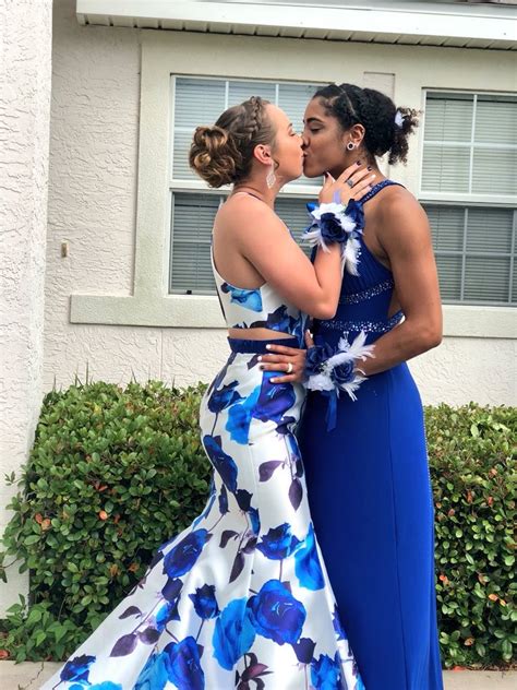 lesbian couple shares a kiss in public as they step out for 2018 prom in matching blue outfits