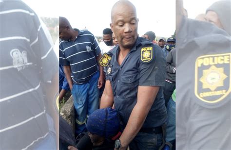 south african police officer risks life to save gogo from a raging river