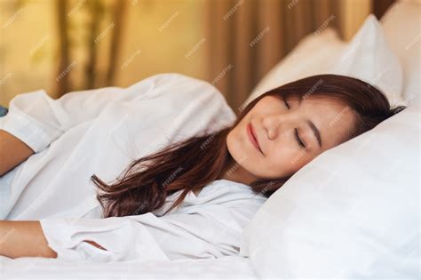 Premium Photo A Beautiful Asian Woman Sleeping In A White Cozy Bed At Home