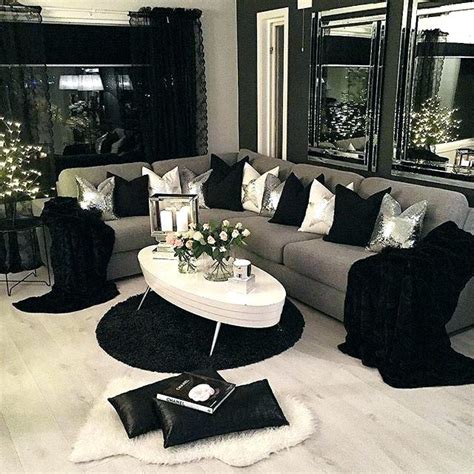 The chairs are upholstered in faux leather. Black White Grey Living Room Design