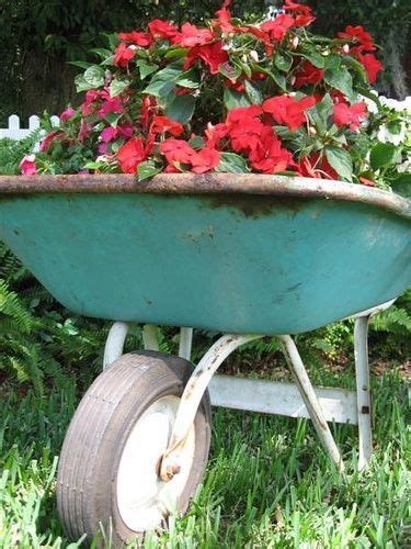 Images Of Flowers In Wheelbarrows Old Wheelbarrow With Flowers