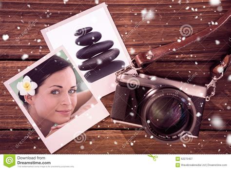 Composite Image Of Beautiful Brunette Relaxing On Massage Table Smiling