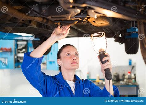 Mechanic Shining Torch Under Car Stock Image Image Of Indoors