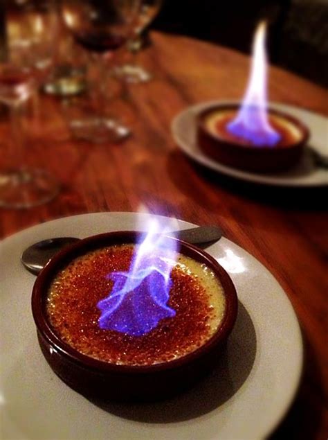 Flaming creme brûlée in Carcassonne Flambe desserts French creme