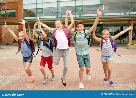 Group Of Happy Elementary School Students Running Stock Image Image