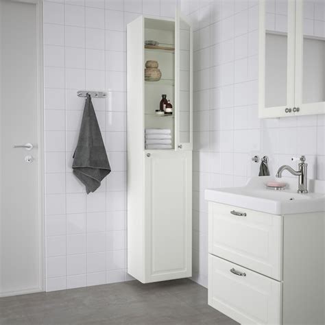 Short of building some sort of box to attach the fixture to to align the light with the cabinet, we can't think of other possibilities. GODMORGON High cabinet - Kasjön white - IKEA