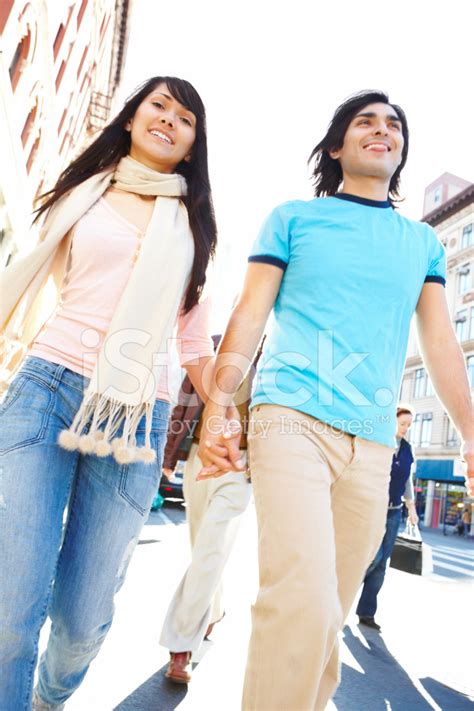 Modern Young Couple Walking Down The Street Stock Photo Royalty Free