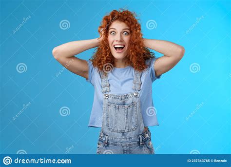 Excited Amused Joyful Redhead Curly Girl Having Amazing Perfect News