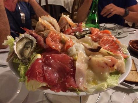 Risotto culatello e asparagi con cuore di burrata. Cruditè di pesce - Picture of Cantina Don Carlo, San ...