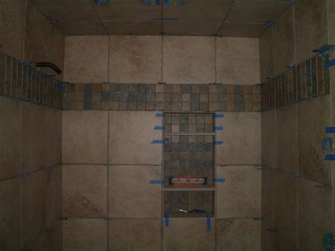 Installing tile in bathroom start installing the first row of full tiles from the most visible corner, when. bathroom tile 12x12 design | Bathroom. DIY Install Best ...