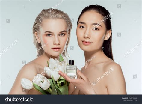 Beautiful Naked Multicultural Women Posing Tulips Stock Photo
