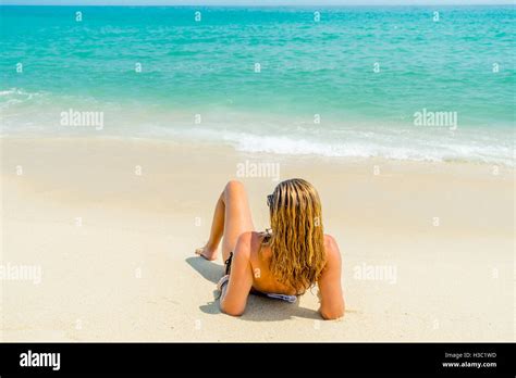 Woman Suntanning On The Beach On The Beach Stock Photo Alamy