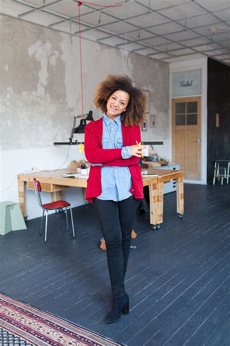 Portrait Of A Ambitious Young Woman Of Mixed Race In A Hip Office By
