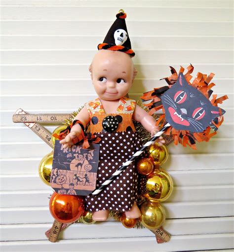 trick or treat here is a fun halloween decoration made with vintage and new materials this