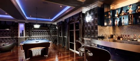 Turn a game into an experience by transforming your game room into the ultimate home entertainment experience. Recreation room | Entertainment room, Game room design ...