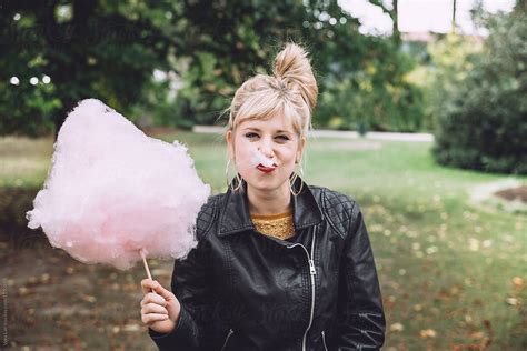 Blonde Woman Eating A Cotton Candy By Vera Lair