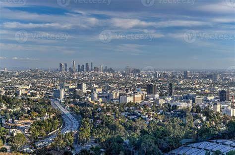 Downtown Los Angeles skyline over blue cloudy sky in California from