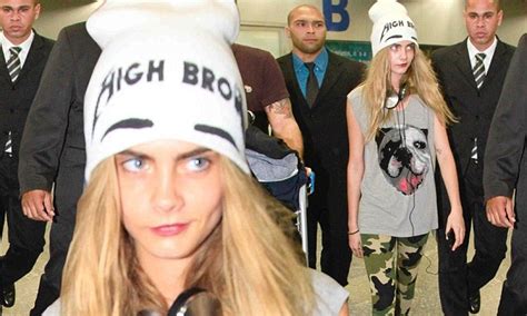 Cara Delevingne Goes Incognito In Camouflage Skinny Jeans And A Large Beanie As She Arrives In