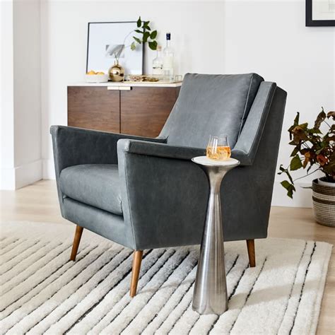 The seat is pretty deep, the back is low, and the arm rests overall while we think there are few chairs as pretty in the price range, the lack of comfort makes it less than ideal and we recommend waiting for a sale. Carlo Leather Mid-Century Chair | West Elm