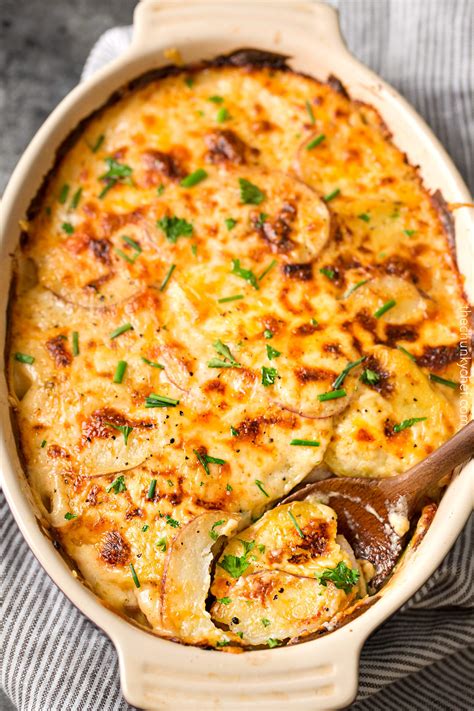 Place the sliced potatoes in the baking dish. cream cheese scalloped potatoes