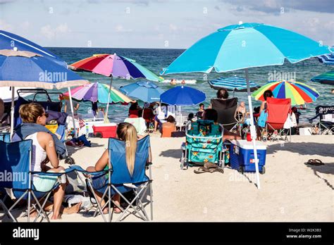 People Sunbathing On Miami Beach Stock Photos And People Sunbathing On