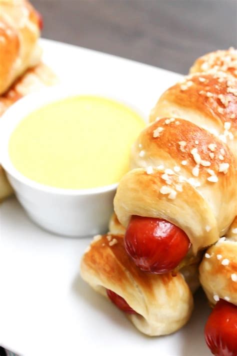 These mini everything pretzel dogs are perfect for snacking on when watching the game! EASY PRETZEL HOT DOGS RECIPE - A Dash of Sanity