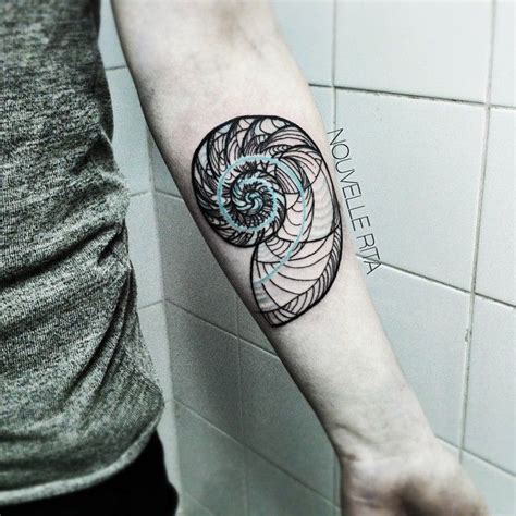 For example, you can look up a spiral that obeys the fibonacci rule for its design and use that. #nouvellerita #nautilus #fibonacci #tattoo #tattrx # ...