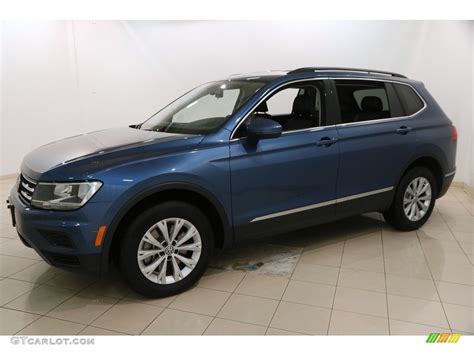 The 2018 volkswagen tiguan starts at a manufacturer's suggested retail price of $26,245 and tops out at $39,945 with all the bells and whistles. Silk Blue Metallic 2018 Volkswagen Tiguan SE 4MOTION Exterior Photo #130232314 | GTCarLot.com